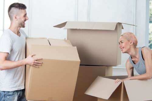 Packed moving boxes ready for house removals in Sipson